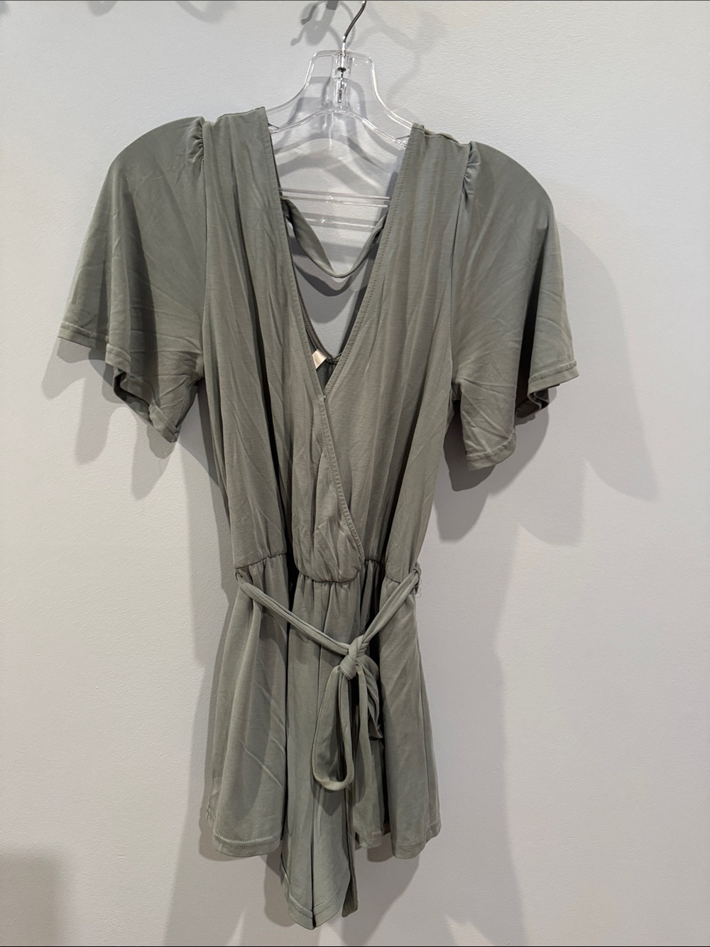 Olive green romper by the brand Daisies.